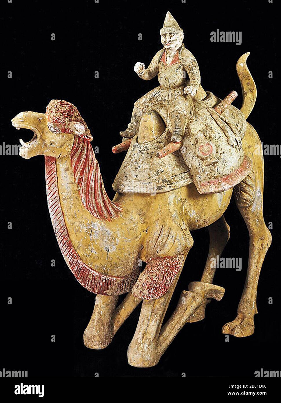 China: A camel rider, probably of Central Asian origin, riding a Bactrian camel, Tang Dynasty (618-907 CE).  The Bactrian camel (Camelus bactrianus) is a large even-toed ungulate native to the steppes of Central Asia. It is presently restricted in the wild to remote regions of the Gobi and Taklimakan Deserts of Mongolia and Xinjiang.  There are a small number of wild Bactrian camels still roaming the Mangystau Province of South West Kazakhstan. It is one of the two surviving species of camel. The Bactrian camel has two humps on its back, in contrast to the single-humped Dromedary camel. Stock Photo