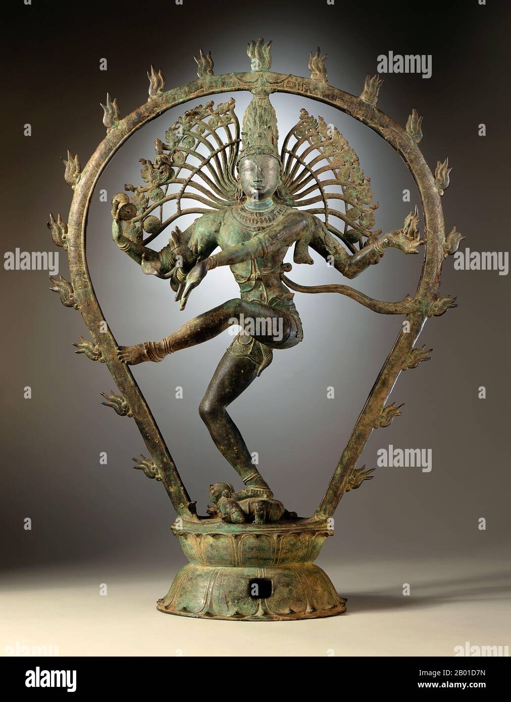India: Shiva Nataraja or 'Dancing Shiva'. Copper alloy statuette from Tamil Nadu, Chola Dynasty, c. 950-1000 CE.  Nataraja or Nataraj ('The Lord (or King) of Dance'; Tamil: Kooththan) is a depiction of the Hindu god Shiva as the cosmic dancer Koothan who performs his divine dance to destroy a weary universe and make preparations for the god Brahma to start the process of creation.  A Tamil concept, Shiva was first depicted as Nataraja in the famous Chola bronzes and sculptures of Chidambaram. Stock Photo