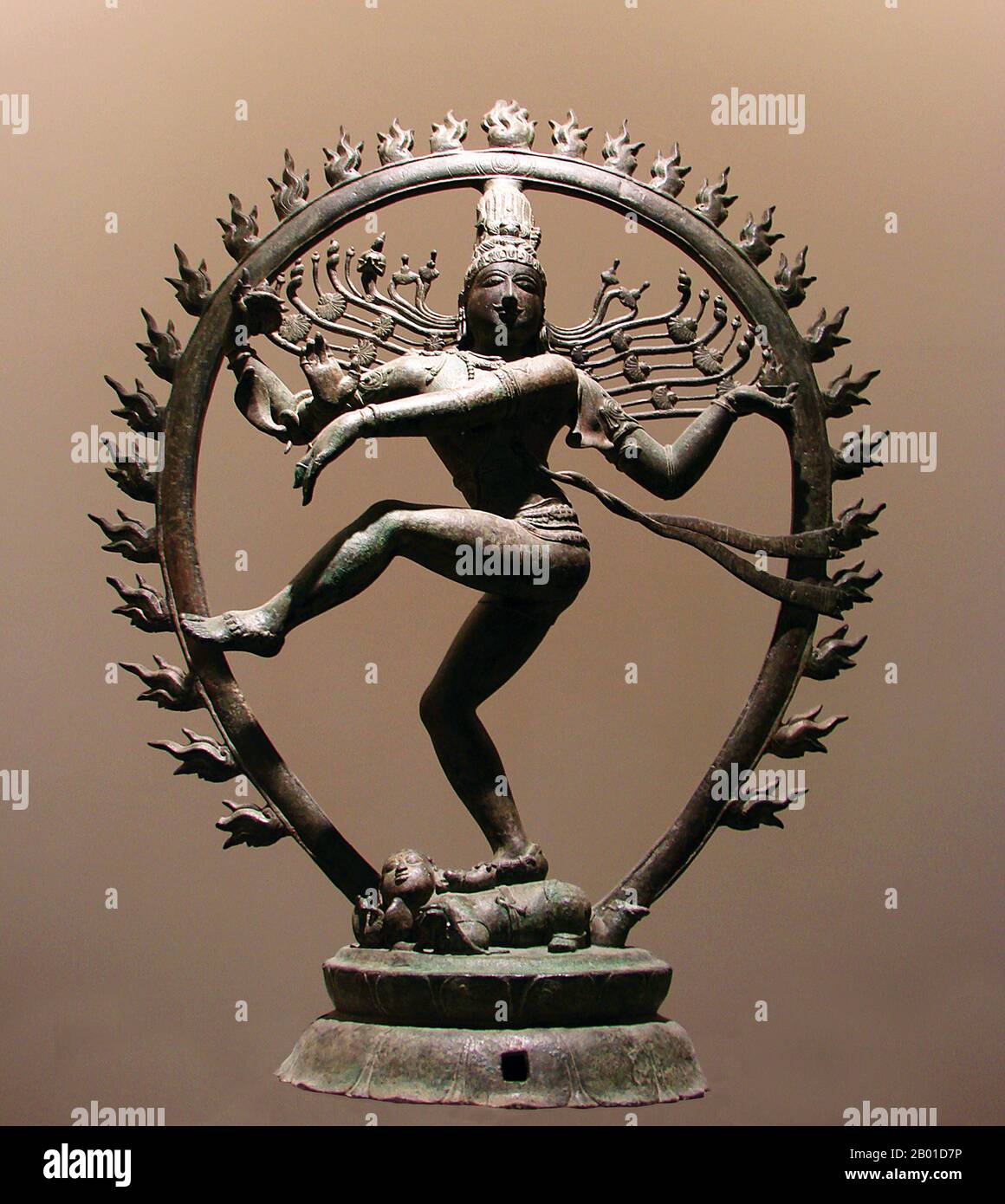 India: Shiva Nataraja or 'Dancing Shiva'. Bronze statuette from Tamil Nadu, Chola Dynasty, c. 11th century.  Nataraja or Nataraj ('The Lord (or King) of Dance'; Tamil: Kooththan) is a depiction of the Hindu god Shiva as the cosmic dancer Koothan who performs his divine dance to destroy a weary universe and make preparations for god Brahma to start the process of creation.  A Tamil concept, Shiva was first depicted as Nataraja in the famous Chola bronzes and sculptures of Chidambaram. Stock Photo