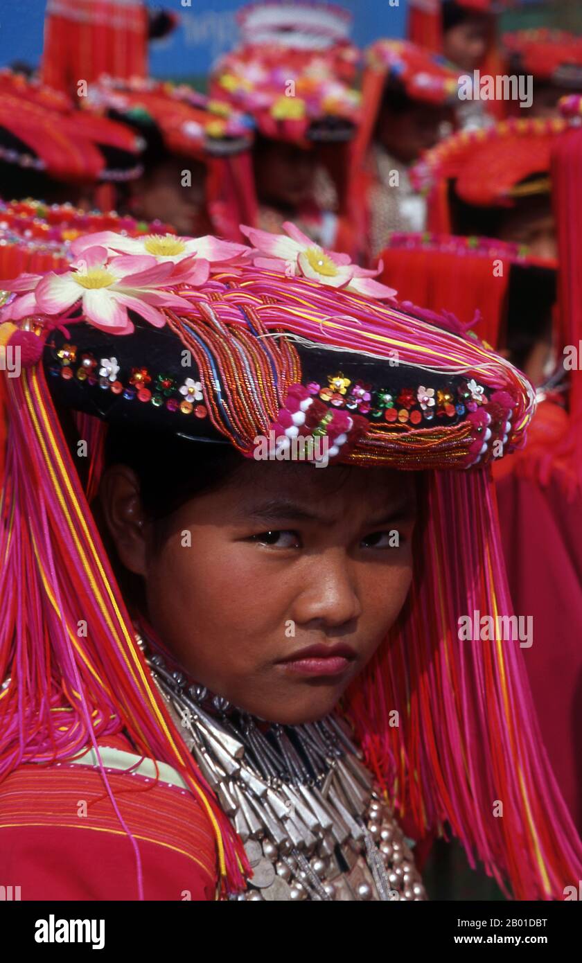 Thailand: Lisu woman with a colourful headdress at Lisu New Year festivities, Chiang Mai Province, northern Thailand.  The Lisu people (Lìsù zú) are a Tibeto-Burman ethnic group who inhabit the mountainous regions of Burma (Myanmar), Southwest China, Thailand, and the Indian state of Arunachal Pradesh.  About 730,000 live in Lijiang, Baoshan, Nujiang, Diqing and Dehong prefectures in Yunnan Province, China. The Lisu form one of the 56 ethnic groups officially recognized by the People's Republic of China. In Burma, the Lisu are known as one of the seven Kachin minority groups. Stock Photo