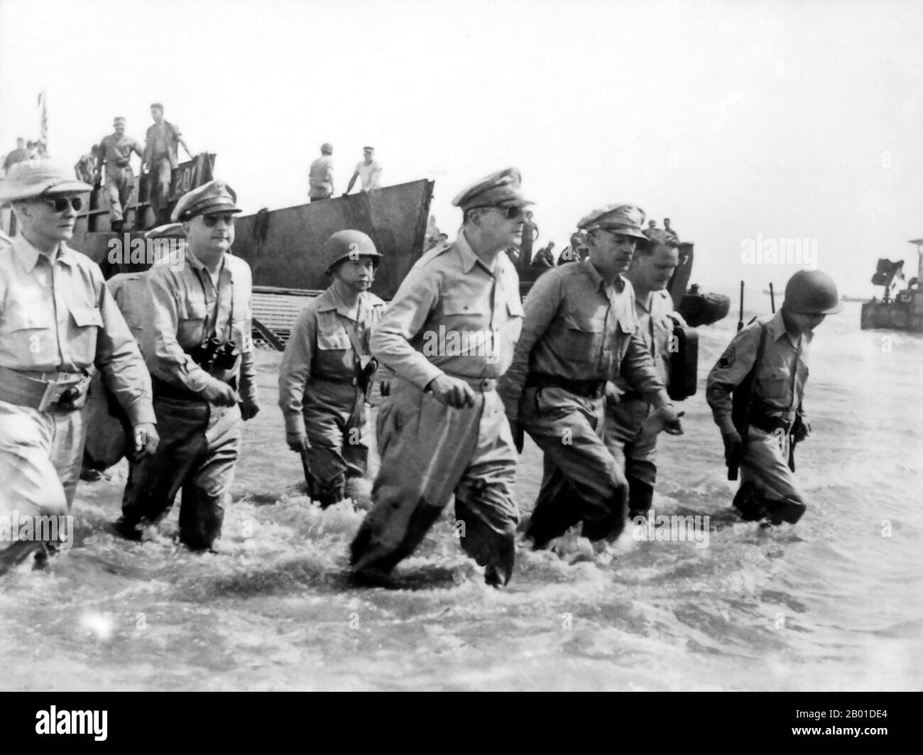 USA/Philippines: 'I have returned' — General MacArthur returns to the Philippines with Philippine President Sergio Osmena to his right and General Richard K. Sutherland on his left, Leyte, 20 October 1944.  General of the Army Douglas MacArthur (26 January 26 1880 - 5 April 1964) was an American general and field marshal of the Philippine Army. He was a Chief of Staff of the United States Army during the 1930s and played a prominent role in the Pacific theater during World War II. He received the Medal of Honor for his service in the Philippines Campaign. Stock Photo