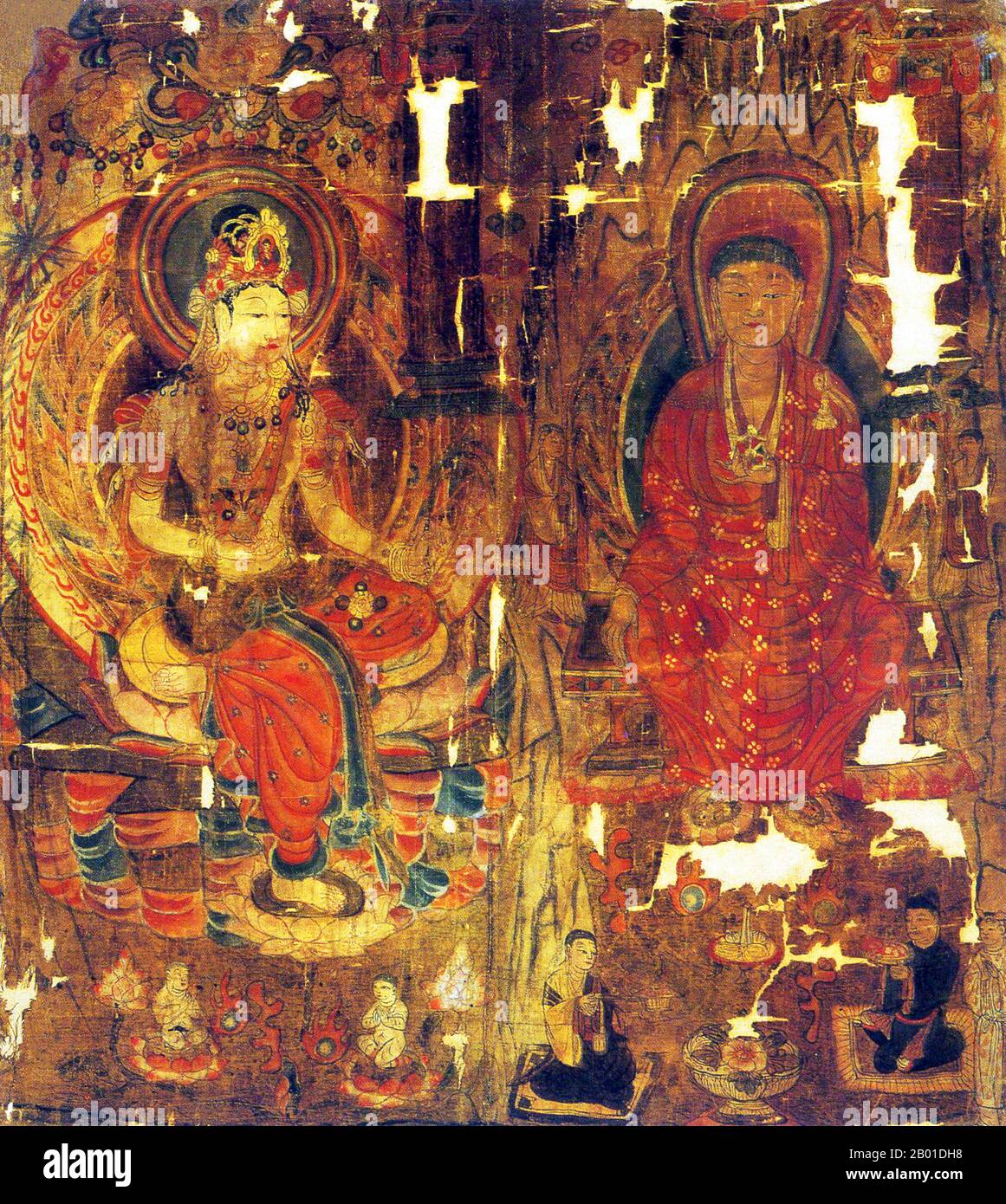 China: Guanyin 'Goddess of Mercy' and a bodhisattva with monks and worshippers, silk painting, Mogao Caves, Dunhuang, Five Dynasties period (907-960 CE).  The Mogao Caves, or Mogao Grottoes (Chinese: mògāo kū, also known as the Caves of the Thousand Buddhas and Dunhuang Caves) form a system of 492 temples 25 km (15.5 miles) southeast of the center of Dunhuang, an oasis strategically located at a religious and cultural crossroads on the Silk Road, in Gansu province, China.  The caves contain some of the finest examples of Buddhist art spanning a period of 1,000 years. Stock Photo