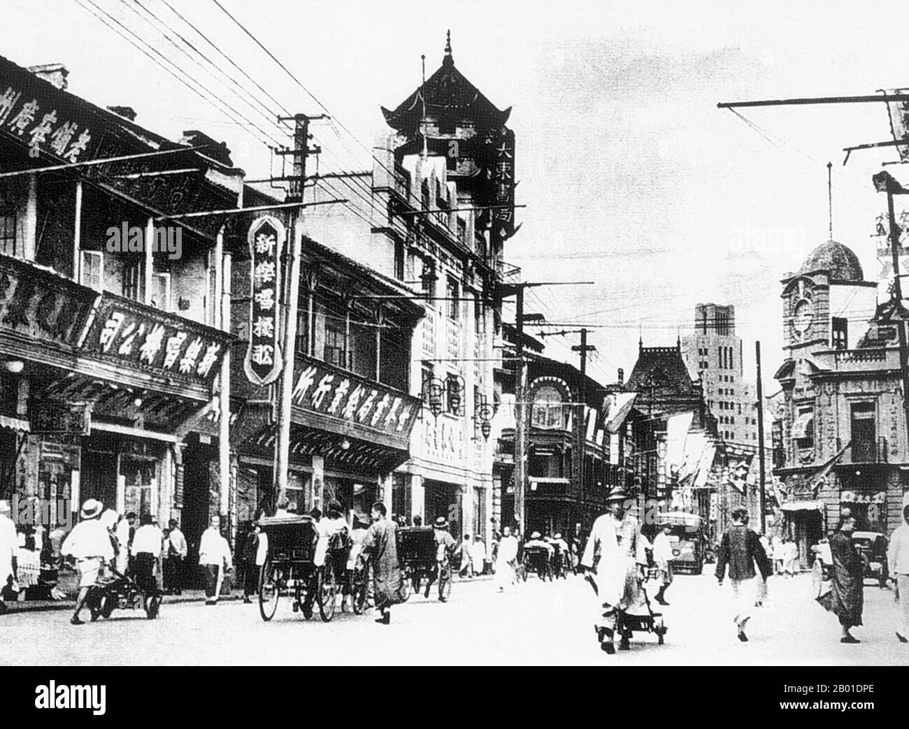 China: Shanghai's Fuzhou Road in the  French Concession, early 20th century.  The Shanghai French Concession (Chinese: 上海法租界; pinyin: Shànghǎi Fǎ Zūjiè, French: La concession française de Shanghai) was a foreign concession in Shanghai, China from 1849 until 1946, and it was progressively expanded in the late 19th and early 20th centuries.  The concession came to an end in practice in 1943 when the Vichy French government signed it over to the pro-Japanese puppet government in Nanking. Stock Photo