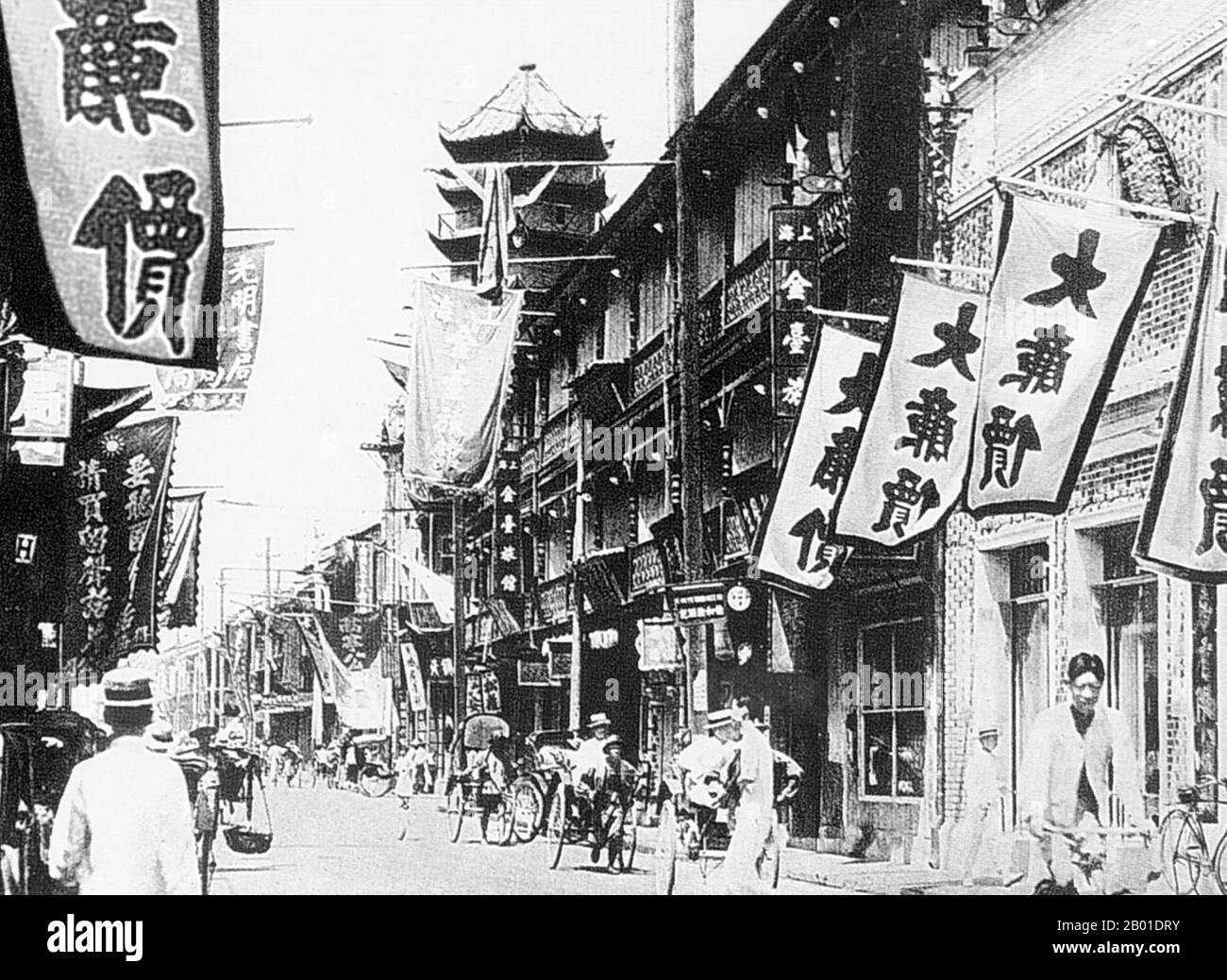 China: A long row of shops on Shanghai's Fuzhou Road, 1930s.  Shanghai (Chinese: 上 海; Pinyin Shànghǎi) is one of the largest cities by population in the People's Republic of China, and the world. The city is located in eastern China, at the middle portion of the Chinese coast, and sits at the mouth of the Yangtze River. Due to its rapid growth over the last two decades it has again become a global city, exerting influence over finance, commerce, fashion, technology and culture.  Once a mere fishing and textiles town, Shanghai grew in importance in the 19th century. Stock Photo