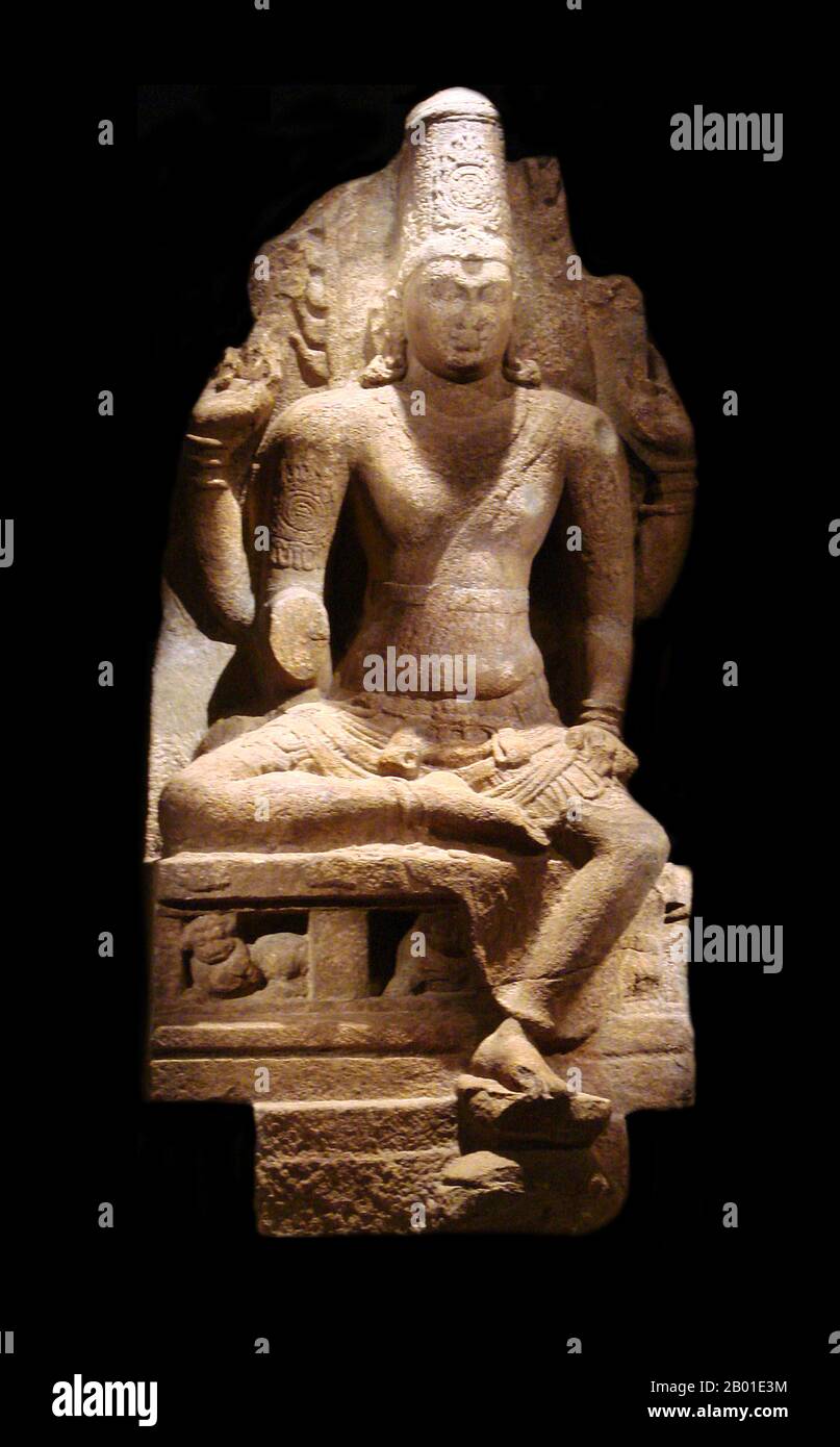 India: A four-armed, seated stone Vishnu image. Pandya Dynasty, Deccan, 8th-9th century CE. Photo by PHGCOM (CC BY-SA 3.0 License).  Vishnu (Sanskrit विष्णु Viṣṇu) is the Supreme god in the Vaishnavite tradition of Hinduism. Smarta followers of Adi Shankara, among others, venerate Vishnu as one of the five primary forms of God.  The Vishnu Sahasranama declares Vishnu as Paramatma (supreme soul) and Parameshwara (supreme God). It describes Vishnu as the All-Pervading Essence of All Beings, the master of the past, present and future, one who supports, sustains and governs the Universe. Stock Photo