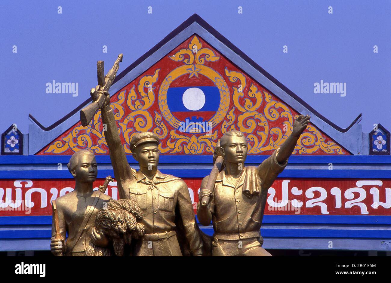 Laos: Socialist realism statue in Vientiane showing workers and soldiers in the revolution.  Socialist realism is a style of realistic art which was developed in the Soviet Union and became a dominant style in other communist countries. Socialist realism is a teleologically-oriented style having its purpose the furtherance of the goals of socialism and communism. Although related, it should not be confused with social realism, a type of art that realistically depicts subjects of social concern. Unlike social realism, socialist realism often glorifies the roles of the poor. Stock Photo