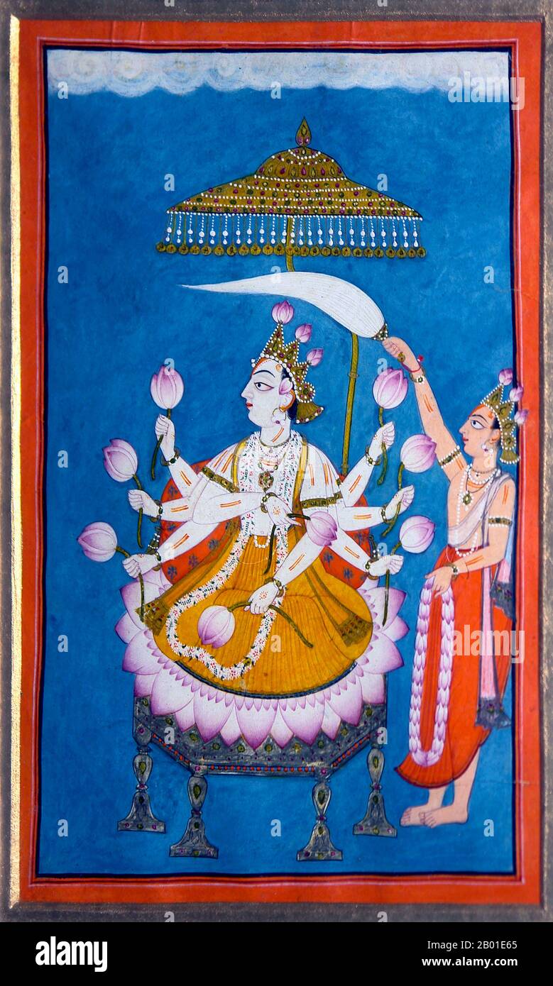 India: The God Vishnu seated, holding lotus flowers, fanned by an attendant. Mankot-Basohli, Pahari, c. 1750 CE.  Vishnu (Sanskrit विष्णु Viṣṇu) is the Supreme god in the Vaishnavite tradition of Hinduism. Smarta followers of Adi Shankara, among others, venerate Vishnu as one of the five primary forms of God.  The Vishnu Sahasranama declares Vishnu as Paramatma (supreme soul) and Parameshwara (supreme God). It describes Vishnu as the All-Pervading essence of all beings, the master of - and beyond - the past, present and future, one who supports, sustains and governs the Universe. Stock Photo