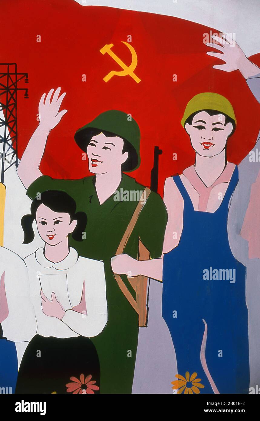 Vietnam: Revolutionary Socialist realist-style political hoardings can be seen in all corners of Vietnam.  Socialist realism is a style of realistic art which was developed in the Soviet Union and became a dominant style in other communist countries. Socialist realism is a teleologically-oriented style having its purpose the furtherance of the goals of socialism and communism. Although related, it should not be confused with social realism, a type of art that realistically depicts subjects of social concern. Unlike social realism, socialist realism often glorifies the roles of the poor. Stock Photo