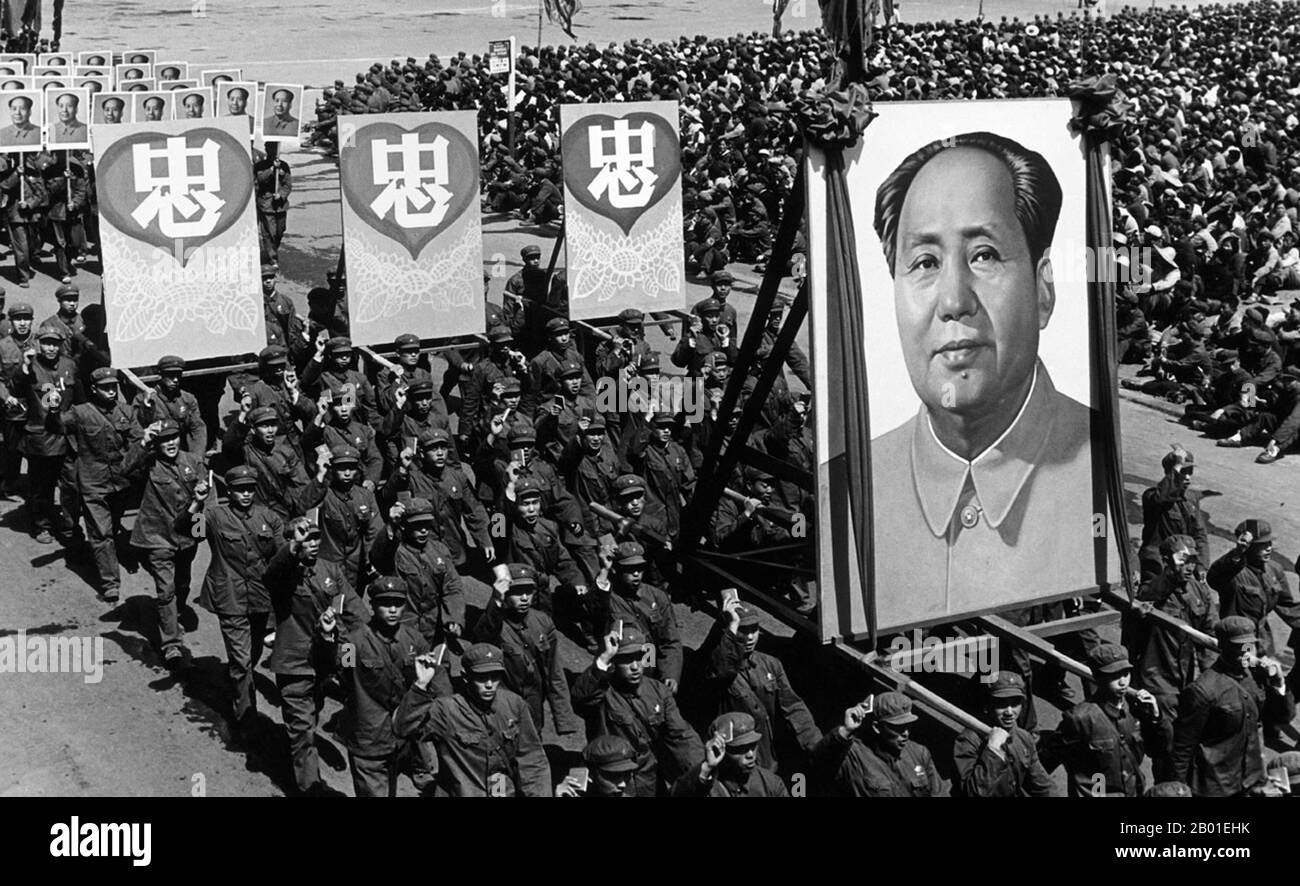 China: A scene from the Cultural Revolution (1966-1976), mass demonstration in Shenyang, 1968.  The Chinese characters read 'In Our Hearts', with reference to Chairman Mao Zedong.  The Great Proletarian Cultural Revolution, commonly known as the Cultural Revolution (Chinese: 文化大革命), was a socio-political movement that took place in the People's Republic of China from 1966 through 1976. Set into motion by Mao Zedong, then Chairman of the Communist Party of China, its stated goal was to enforce socialism in the country by removing capitalist, traditional and cultural elements from society. Stock Photo