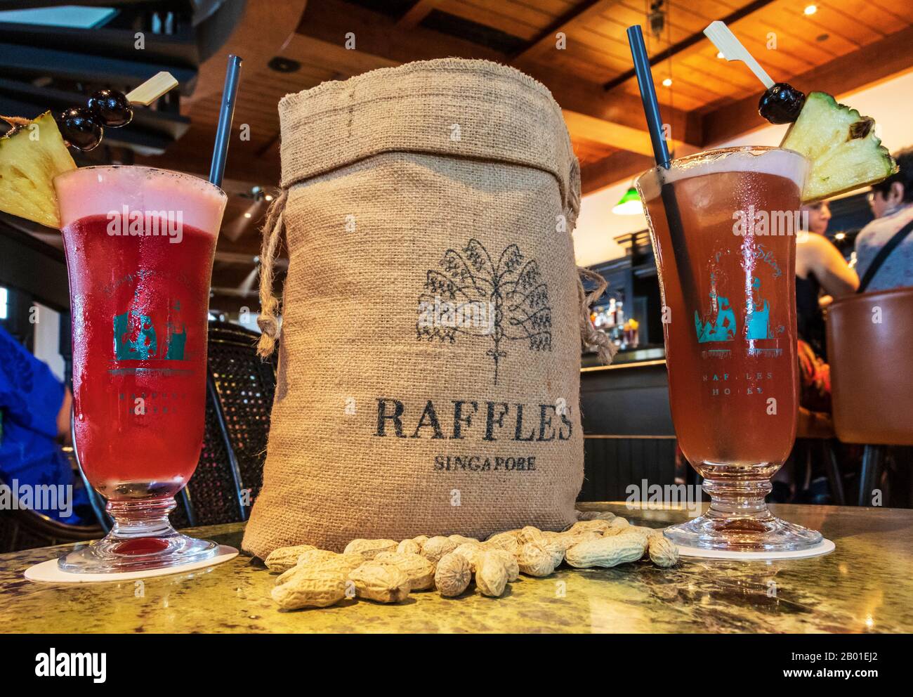 Raffles Bar in Singapore showing a bag of peanuts, peanuts on the table