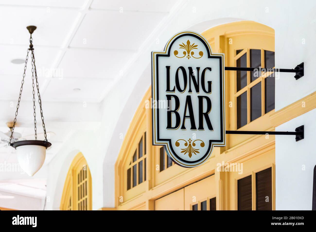 Wall mounted sign for the Raffles Hotel, Long Bar, famous for selling the 1930's alcoholic gin cocktail, Singapore Sling. Singapore, Asia. Stock Photo