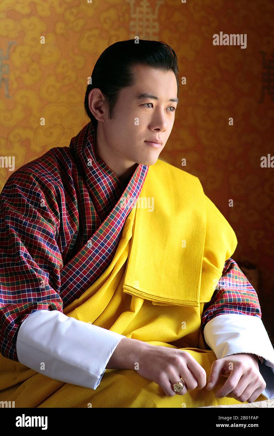 King Khesar (pronounced Gesar) is the eldest son of the fourth and previous Dragon King of Bhutan, Jigme Singye Wangchuck, and his father's third wife, Queen (Ashi) Tshering Yangdon.  After completing his higher secondary studies from Yangchenphu Higher secondary school, Bhutan, Khesar studied abroad at Phillips Academy (Andover, Massachusetts), Cushing Academy and Wheaton College in Massachusetts, United States, before graduating from Magdalen College, University of Oxford, United Kingdom, where he completed the Foreign Service Programme and International Relations.  In December 2005, King Ji Stock Photo