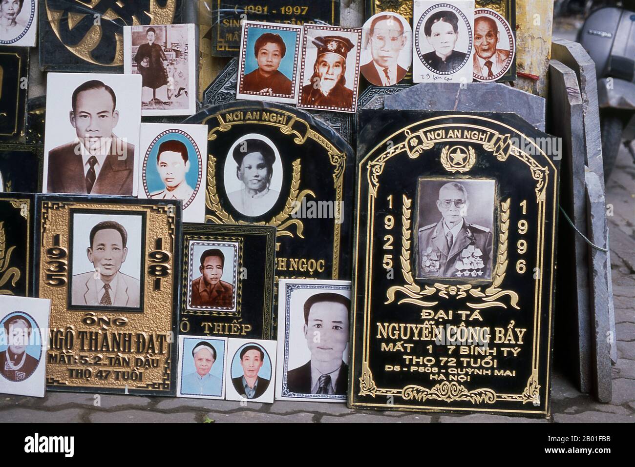 Vietnam: Marble gravestones, Pho Hang Bac Street, Old Quarter, Hanoi.  Hanoi's Old Quarter lies immediately north of Ho Hoan Kiem lake. It's better known locally as Bam Sau Pho Phuong or the ‘Thirty Six Streets’. 'Phuong' means a trade guild, and most of the streets begin with the word 'hang' meaning merchandise. This ancient section of the city has long been associated with commerce, and it remains very much so today. Stock Photo