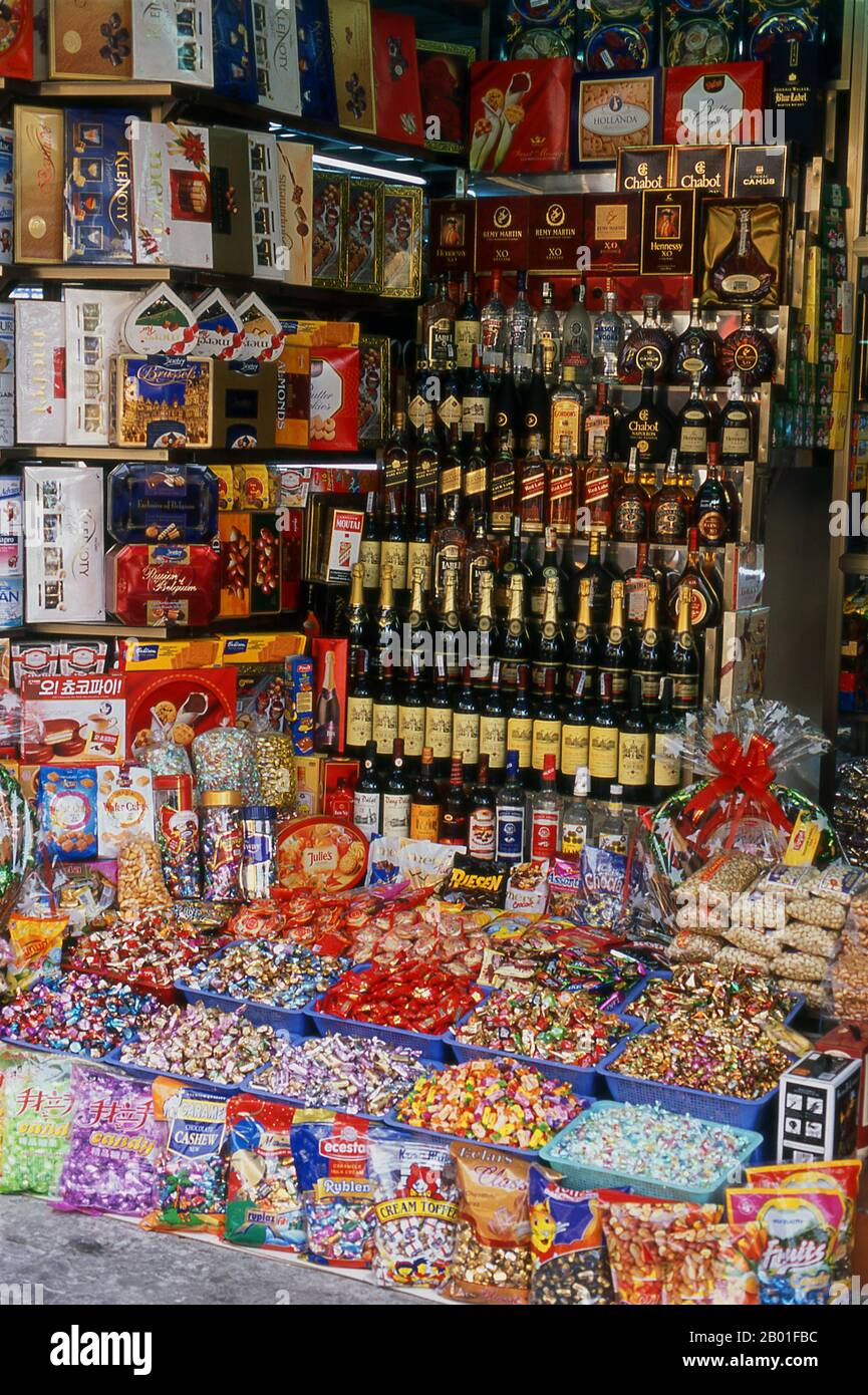 Vietnam: Alcohol, sweets and biscuits, Hang Buom Street, Old Quarter, Hanoi.  Hanoi's Old Quarter lies immediately north of Ho Hoan Kiem lake. It's better known locally as Bam Sau Pho Phuong or the ‘Thirty Six Streets’. 'Phuong' means a trade guild, and most of the streets begin with the word 'hang' meaning merchandise. This ancient section of the city has long been associated with commerce, and it remains very much so today. Stock Photo