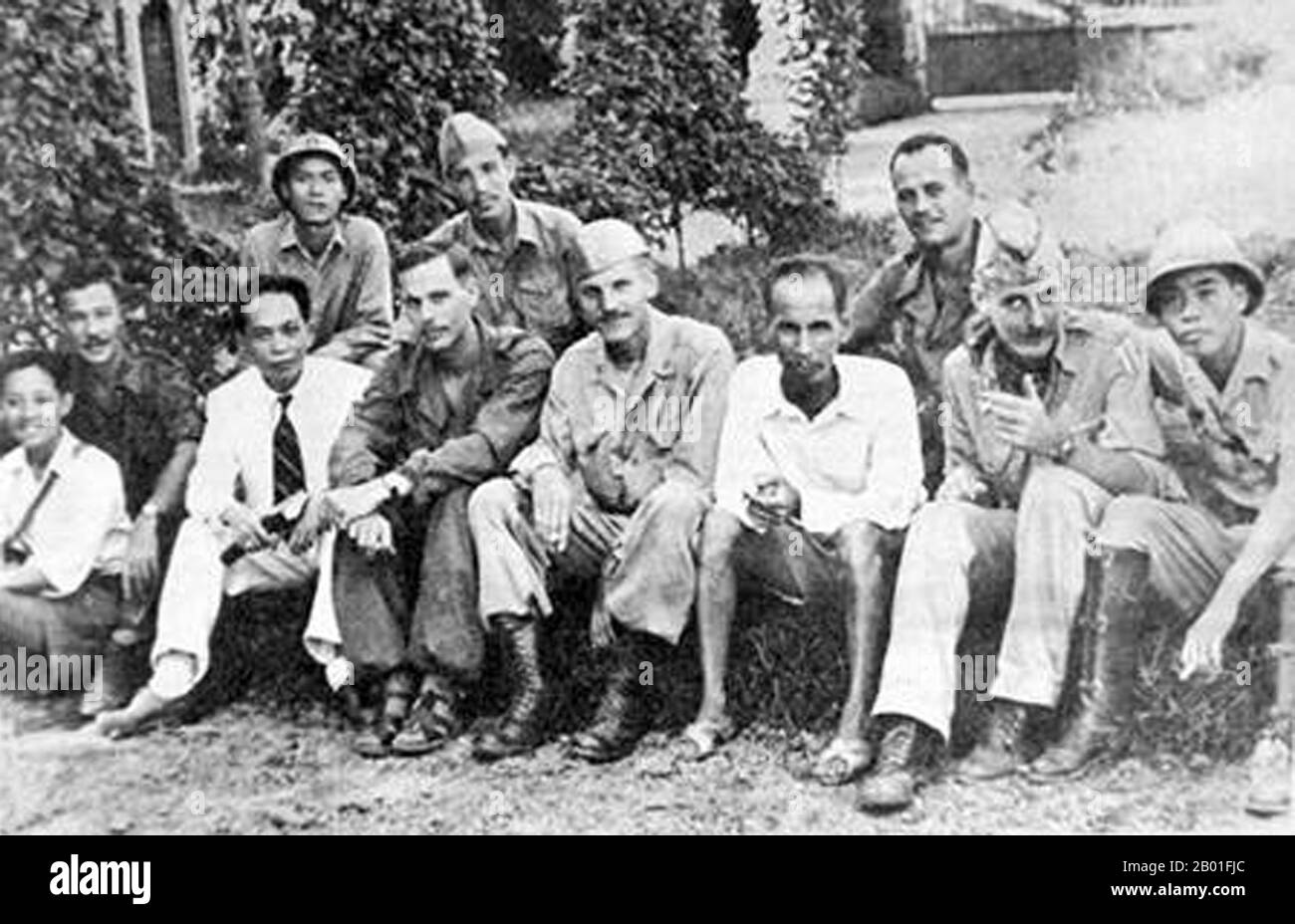 Vietnam: Indistinct but historically significant pictures of Vo Nguyen Giap and Ho Chi Minh with American OSS officers including Lieutenant Colonel Peter Dewey (centre), OSS Deer Team, c. 1945.  Dewey arrived on September 4, 1945 in Saigon to head a seven-man OSS team 'to represent American interests' and collect intelligence. Working with the Viet Minh, he arranged the repatriation of 4,549 Allied POWs, including 240 Americans, from two Japanese camps near Saigon, code named Project Embankment. Stock Photo