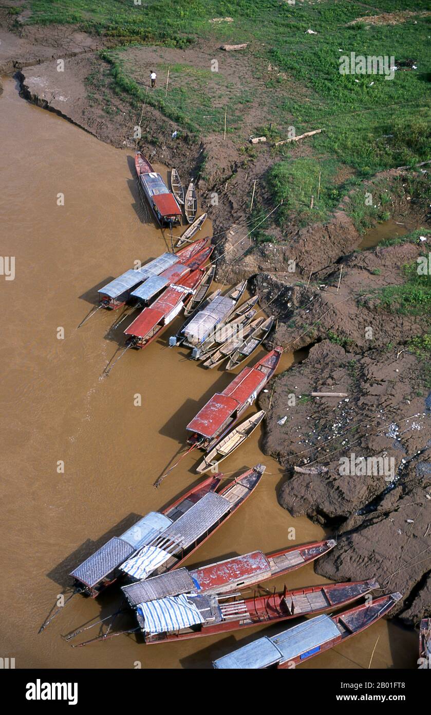 Vietnam: Boats moored on the Song Da (Black River), Muong Khoa, Northwest Vietnam.  The Black River (also known as the Da River, Sông Đà in Vietnamese and Lixian River in China) is a river located in China and northwestern Vietnam. Its source is in Yunnan Province of China. It runs through the Vietnamese provinces of Lai Châu (where it forms part of the border with Điện Biên Province), Sơn La and Hòa Bình. It is the most important tributary of the Red River, which it joins in Tam Nong District near Việt Trì in Phú Thọ Province. Stock Photo