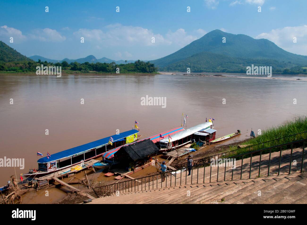 Thailand: Tour boats moored on the Mekong River at Kaeng Khut Khu, Loei Province.  Loei (Thai: เลย) Province is located in Thailand's upper North-East. Neighboring provinces are (from east clockwise) Nong Khai, Udon Thani, Nongbua Lamphu, Khon Kaen, Phetchabun, Phitsanulok. In the north it borders Xaignabouli and Vientiane Provinces of Laos.  The province is covered with low mountains, while the capital Loei is located in a fertile basin. The Loei River, which flows through the province, is a tributary of the Mekong. Stock Photo
