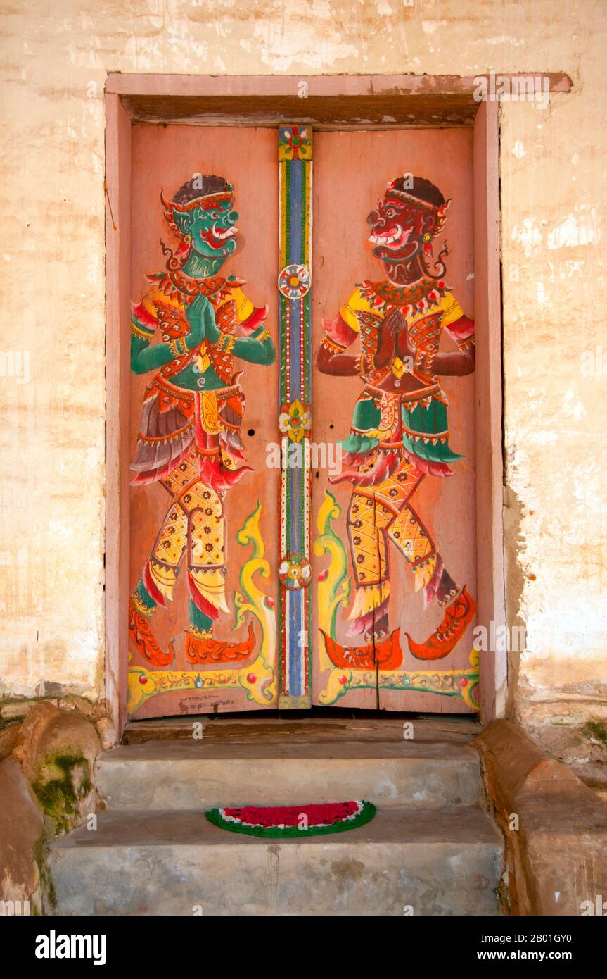 Thailand: Painted guardian figures on the doors of the old viharn at Wat Si Pho Chai Na Phung, Na Haeo District, Loei Province.  Loei (Thai: เลย) Province is located in Thailand's upper North-East. Neighboring provinces are (from east clockwise) Nong Khai, Udon Thani, Nongbua Lamphu, Khon Kaen, Phetchabun, Phitsanulok. In the north it borders Xaignabouli and Vientiane Provinces of Laos.<  The province is covered with low mountains, while the capital Loei is located in a fertile basin. The Loei River, which flows through the province, is a tributary of the Mekong. Stock Photo
