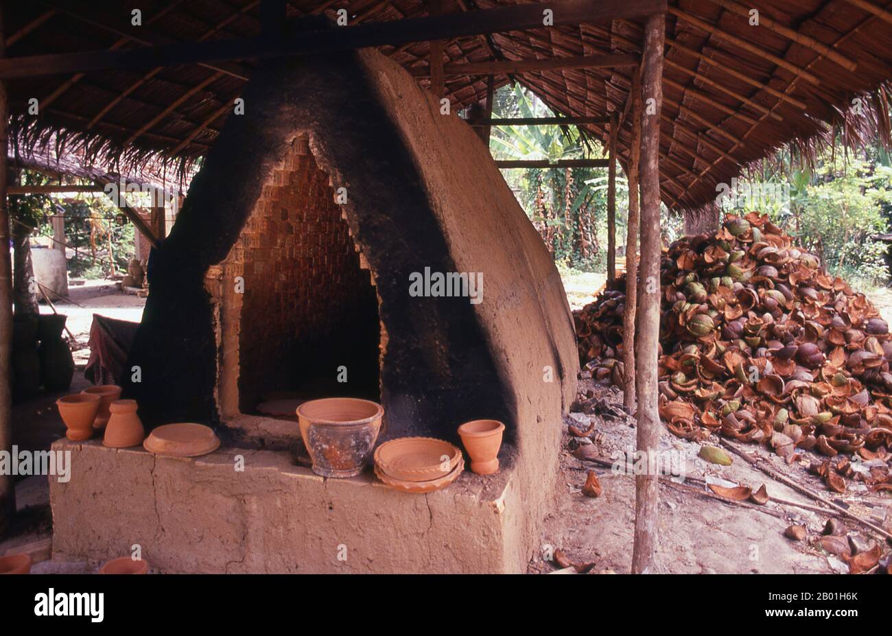 Thailand: Coconut husks used for firing a kiln, Nakhon Sri Thammarat, south Thailand.  Thai ceramics are renowned throughout the world and have over many years offered historians a unique perspective on Thai history. Ancient kilns can be found in many areas of the country including Sawankhalok and Si Satchanalai in Sukhothai Province. Stock Photo