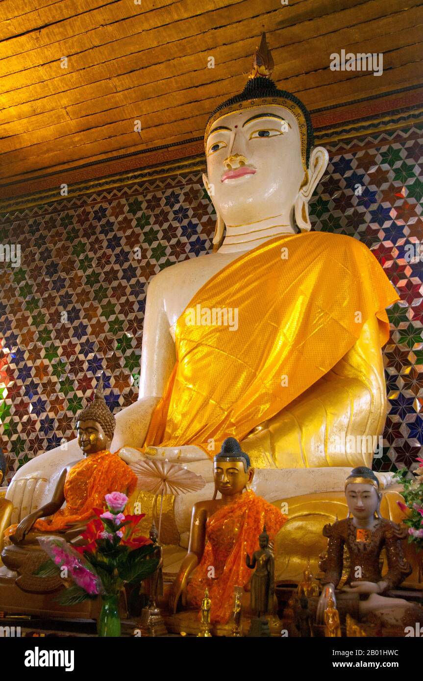 Thailand: Buddha within the viharn at Wat Nong Kham (Pa O temple), Chiang Mai.  The Pa-Oh, also known as Taungthu and Black Karen, are an ethnic group in Burma, comprising approximately 600,000. They form the second largest ethnic group in Shan State, and are believed to be of Tibeto-Burman stock. They are ethnolinguistically related to the Karen and populate Shan State, Kayin State and Kayah State.  King Mengrai founded the city of Chiang Mai (meaning 'new city') in 1296 and it succeeded Chiang Rai as capital of the Lanna kingdom. Chiang Mai is sometimes written as 'Chiengmai' or 'Chiangmai'. Stock Photo