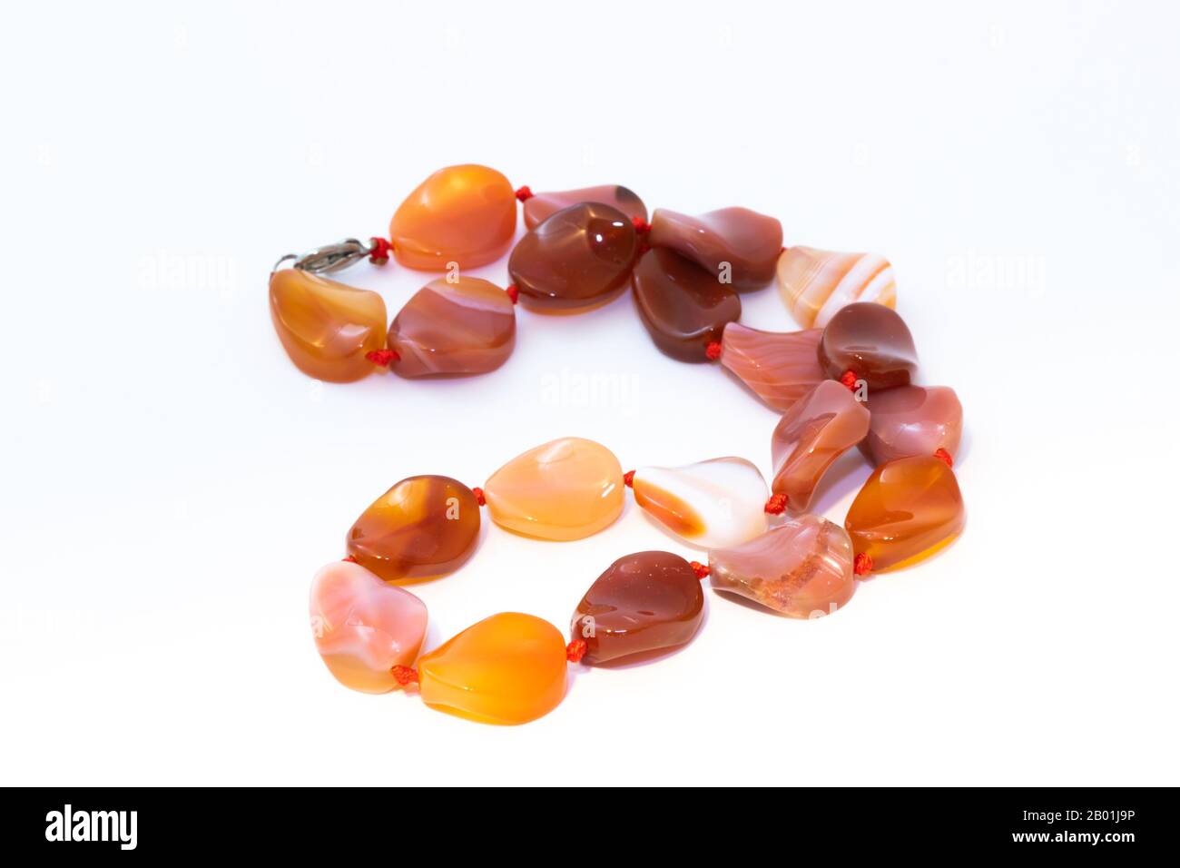 Brown agate beads isolated on white background Stock Photo