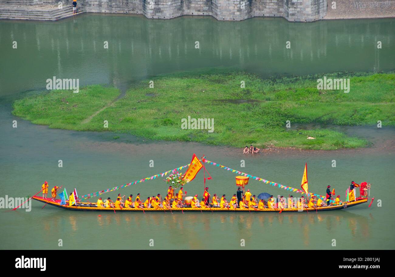 China: Ceremonial boat on the Li River from Fubo Shan (Wave-Subduing Hill), Guilin, Guangxi Province.  Guilin's Dragon Boat Festival is held on the fifth day of the fifth month (May) of the Chinese lunar calendar every 3 years. The festival was originally held in memory of the great Chinese poet, Quyuan.  The name Guilin means ‘Cassia Woods’ and is named after the osmanthus (cassia) blossoms that bloom throughout the autumn period.  Guilin is the scene of China’s most famous landscapes, inspiring thousands of paintings over many centuries. Stock Photo