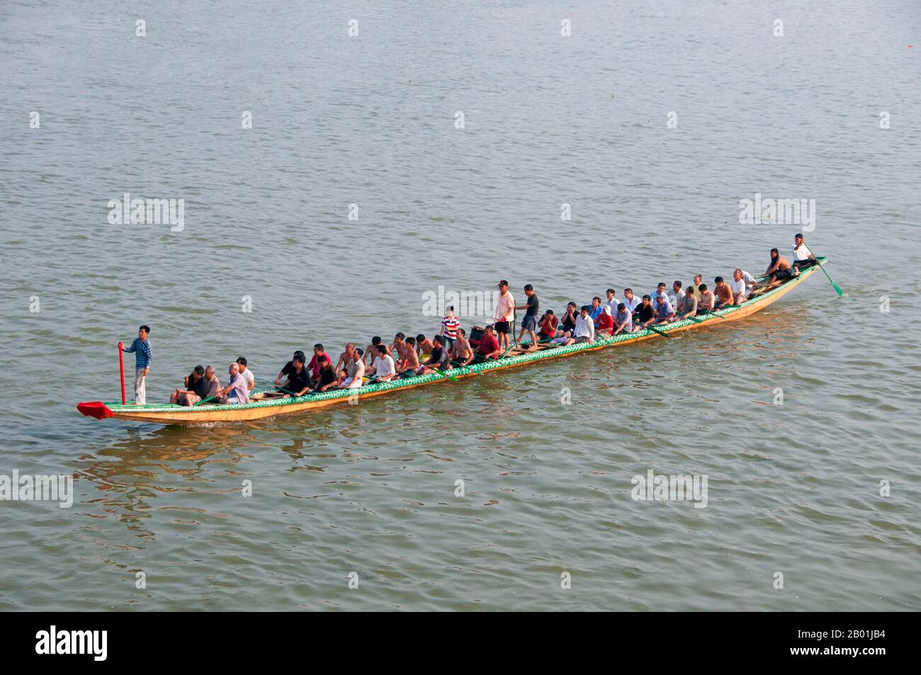 China: Dragon boat and its crew on the Li River, Guilin, Guangxi Province.  Guilin's Dragon Boat Festival is held on the fifth day of the fifth month (May) of the Chinese lunar calendar every 3 years. The festival was originally held in memory of the great Chinese poet, Quyuan.  The name Guilin means ‘Cassia Woods’ and is named after the osmanthus (cassia) blossoms that bloom throughout the autumn period.  Guilin is the scene of China’s most famous landscapes, inspiring thousands of paintings over many centuries. Stock Photo