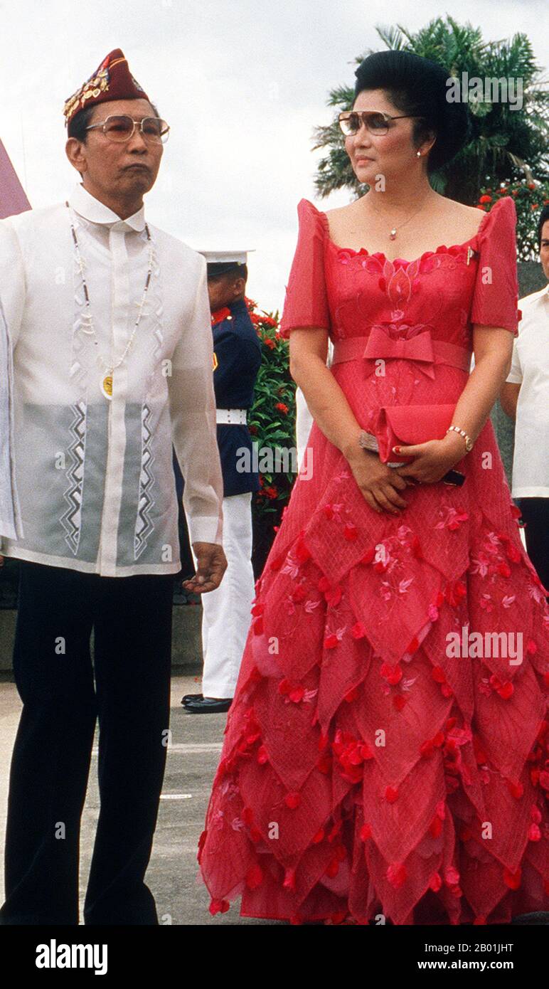 Philippines: President Ferdinand Marcos and First Lady Imelda Marcos in Leyte, 20 October 1984.  Ferdinand Emmanuel Edralin Marcos (11 September 1917 - 28 September 1989) was the 10th President of the Philippines from 1965 to 1986. He was a lawyer, member of the Philippine House of Representatives (1949-1959) and a member of the Philippine Senate (1959-1965).  In 1983, his government was implicated in the assassination of his primary political opponent, Benigno Aquino, Jr. The implication caused a chain of events that eventually led to his removal from power in 1986 and his exile in Hawaii. Stock Photo