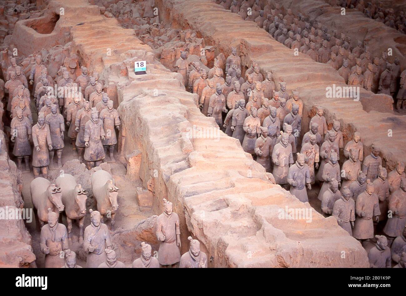 China: Warriors from the terracotta army guarding the tomb of Qin Shi Huang, first emperor of a unified China (r. 246-221 BCE), near Xi'an.  During a drought in 1974, farmers digging a well stumbled across one of the most amazing archaeological finds in modern history - the terracotta warriors.  The terracotta army, thousands of soldiers, horses and chariots, had remained secretly on duty for some 2,000 years, guarding the nearby mausoleum of Qin Shu Huang, the first emperor of a unified China. Stock Photo