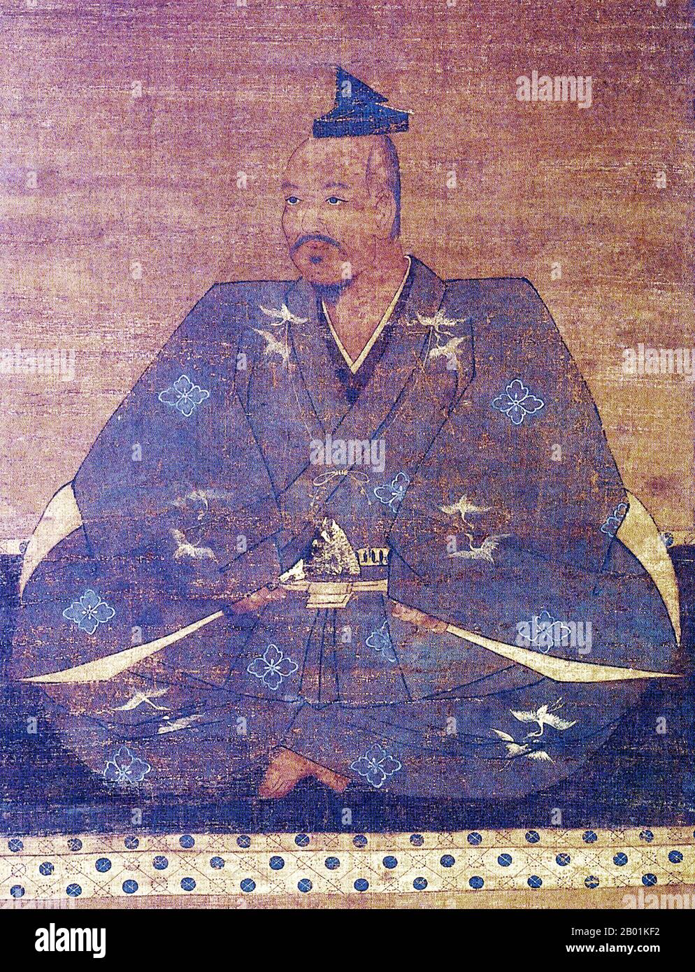 Japan: Takeda Shingen (1 December 1521 – 13 May 1573), Sengoku Period daimyo and militarist. Hanging scroll silk painting, 16th century.  Takeda Shingen, of Kai Province, was a preeminent daimyo in feudal Japan with exceptional military prestige in the late stage of the Sengoku period.  Known as the 'Tiger of Kai', he was one of the most powerful and influential leaders of the era. He is famous for the Battle of Mikatagahara, where he successfully defeated Tokugawa Ieyasu, handing the future shogun one of his worst defeats. He died under unclear circumstances during the Siege of Noda Castle. Stock Photo