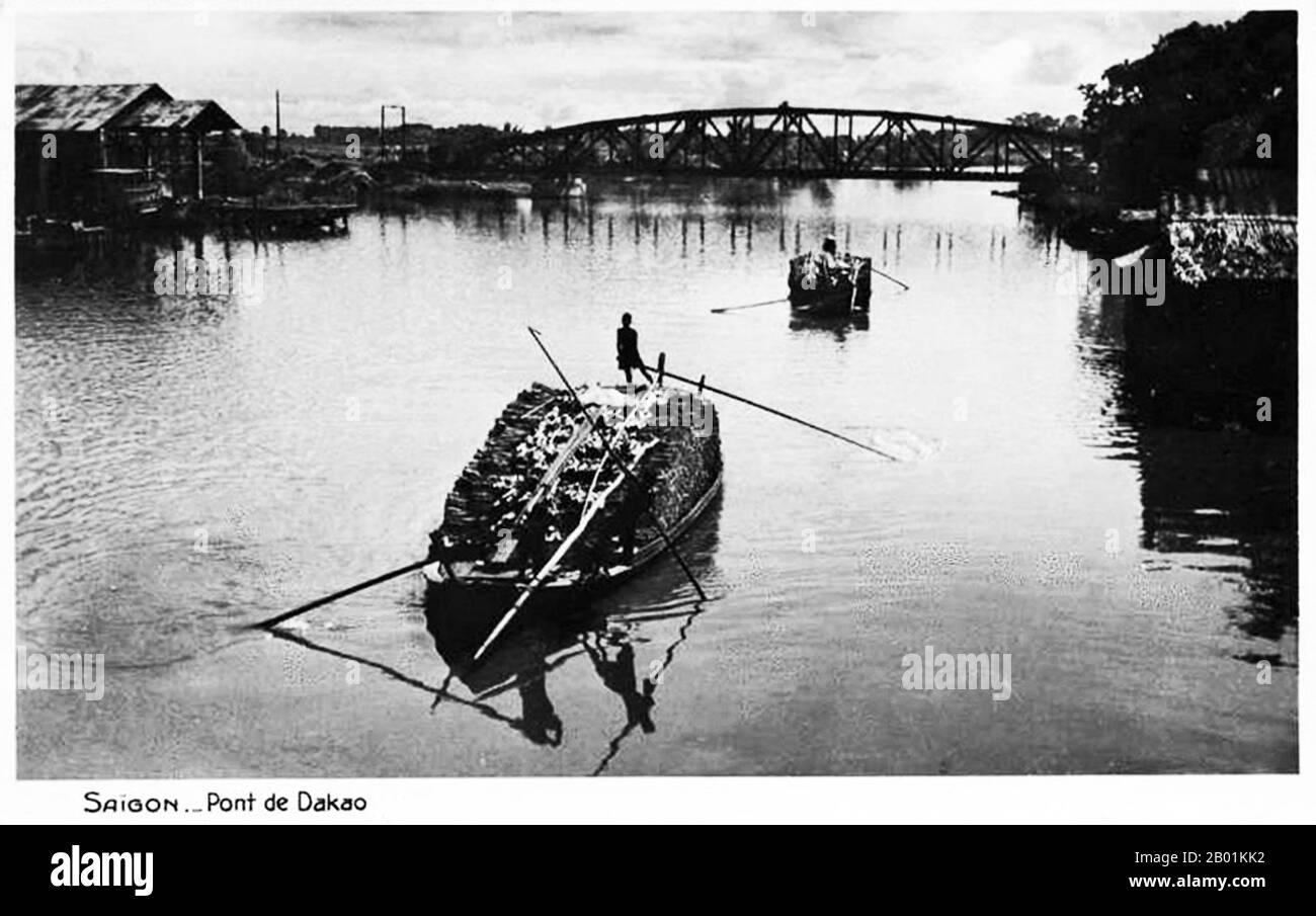 Vietnam: Cầu Sắt Đa Kao, Graham Greene's 'Dakow Bridge' in Saigon (now Ho Chi Minh City). Postcard, c. 1925.  The Quiet American is an anti-war novel by British author Graham Greene, first published in United Kingdom in 1955 and in the United States in 1956. It was adapted into films in 1958 and 2002. The book draws on Greene's experiences as a war correspondent for The Times and Le Figaro in French Indochina 1951-1954. He was apparently inspired to write The Quiet American in October 1951 while driving back to Saigon from the Ben Tre province. Stock Photo