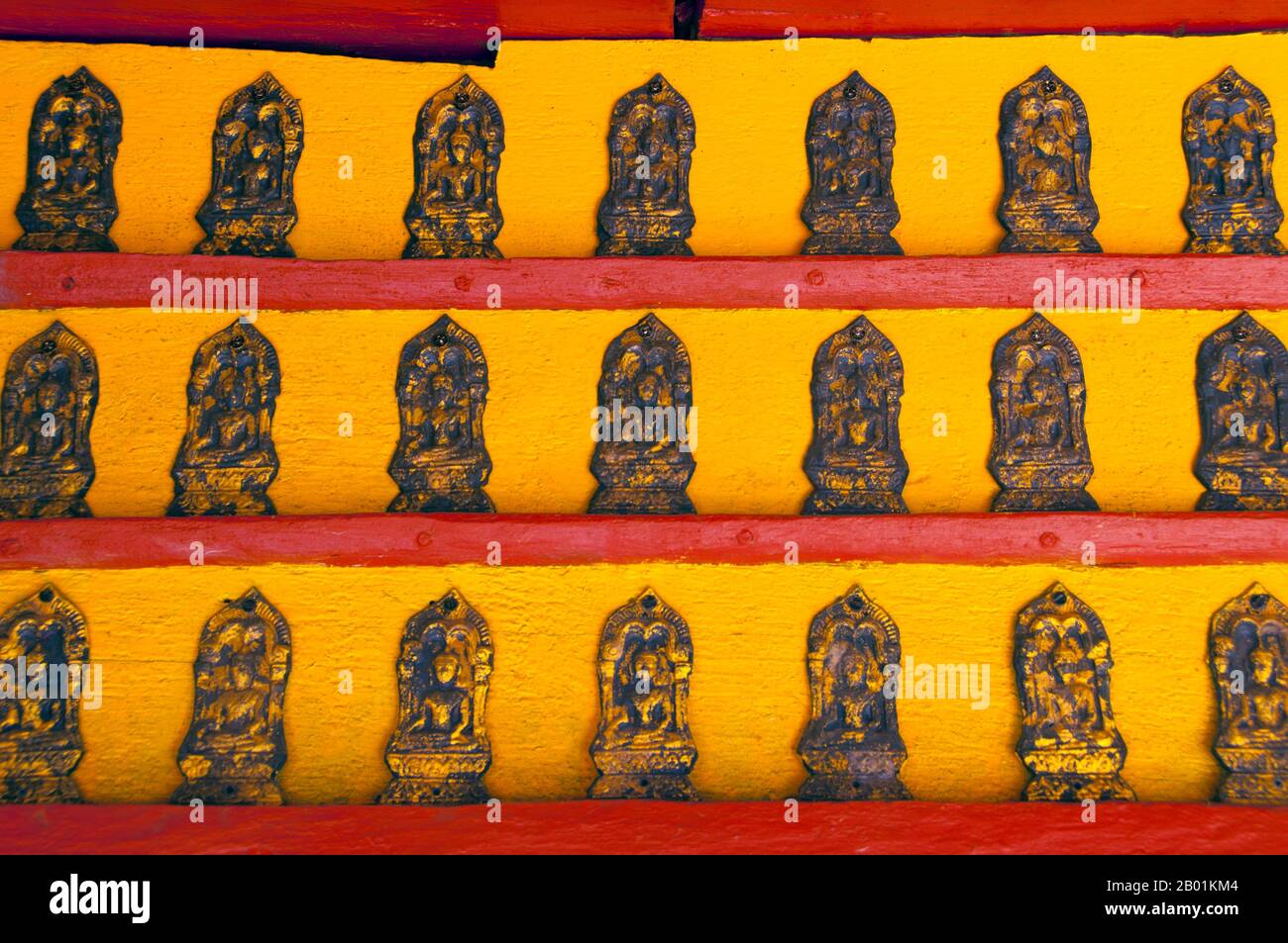 Thailand: Detail of small Buddha statues within the mondop, Wat Pong Sanuk Tai, Lampang, Lampang Province, northern Thailand.  Wat Pong Sanuk Tai or 'The Monastery of the Southern Fun Marsh' was built in the late 18th century combining Burmese and Lanna styles of architecture.  The temple's mondop is one of the finest examples of its type and is a marvelous blend of Lanna and Burmese workmanship.  Lampang was originally founded during the 7th century Dvaravati period. Nothing remains from these early times, but the city is rich in temples, many of which have a distinctly Burmese flavour. Stock Photo