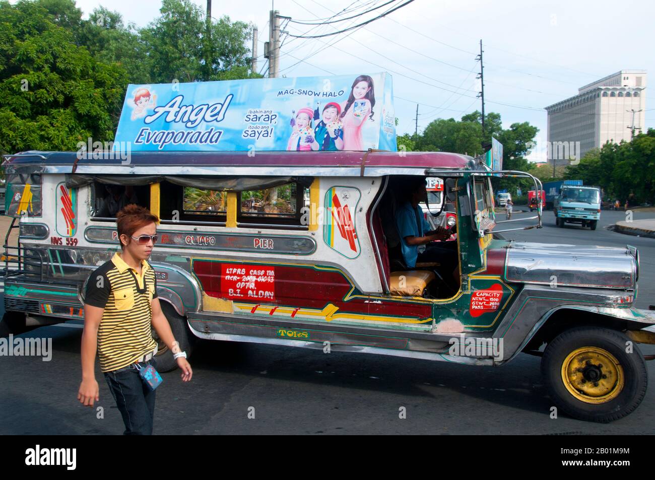 Philippines: Jeepney, Anda Circle, Bonifacio Drive, near Intramuros, Manila.  Jeepneys are the most popular means of public transportation in the Philippines. They were originally made from US military jeeps left over from World War II and are known for their flamboyant decoration and crowded seating. They have become a ubiquitous symbol of Philippine culture. Stock Photo