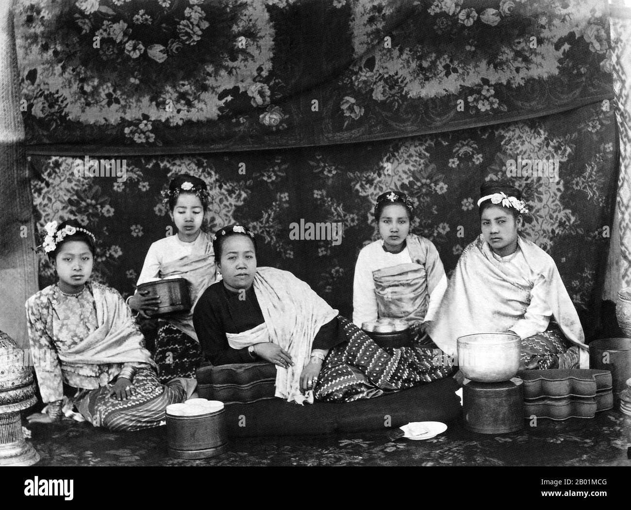 Burma/Myanmar: A well-to-do mother and daughter attended by three maids. Photo by Felice Beato (1832 - 29 January 1909), c. 1885  Felice Beato, also known as Felix, was an Italian-British photographer. He was one of the first people to take photographs in East Asia and one of the first war photographers.  He is noted for his genre works, portraits and views and panoramas of the architecture and landscapes of Asia and the Mediterranean region. Beato's travels gave him the opportunity to create images of countries, people, and events that were unfamiliar and remote to most people. Stock Photo