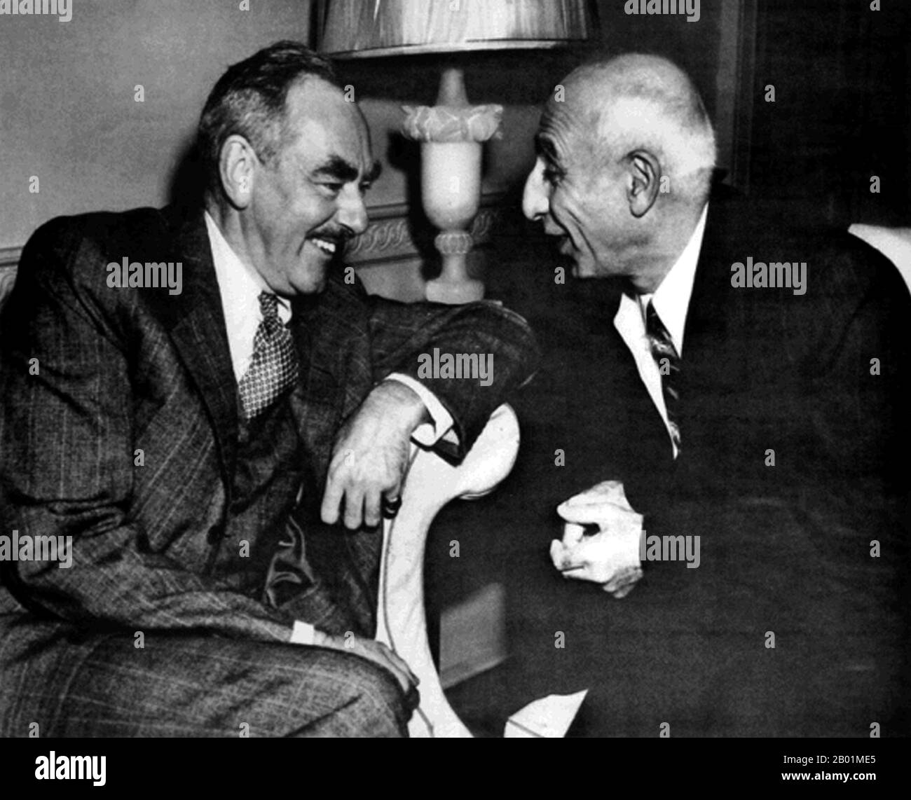 Iran/Persia: Mohammad Mosaddegh (16 June 1882 - 5 March 1967), Prime Minister of Iran from 1951-1953, with US Secretary of State Dean Acheson, Washington DC, 24 October 1951.  The Mossadeq administration introduced a wide range of social reforms but was most notable for its nationalisation of the Iranian oil industry, which had been under British control since 1913 through the Anglo-Persian Oil Company.  Mosaddegh was removed from power in a coup on 19 August 1953, organised and carried out by the United States CIA at the request of British MI6. Stock Photo