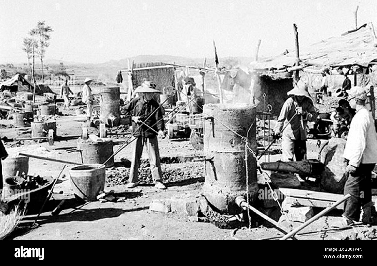 China: Rural industrialisation by 'backyard furnace' workers during the Great Leap Forward (1958-1961).  The Great Leap Forward of the People's Republic of China (PRC) was an economic and social campaign of the Communist Party of China (CPC), reflected in planning decisions from 1958 to 1961, which aimed to use China's vast population to rapidly transform the country from an agrarian economy into a modern communist society through the process of rapid industrialisation, and collectivisation. Mao Zedong led the campaign based on the Theory of Productive Forces. Stock Photo