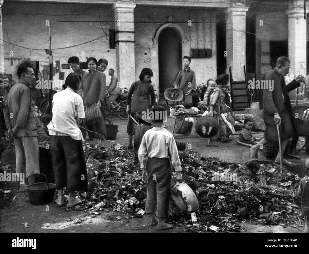 China: Collecting old pots, pans and scrap metal for 'backyard furnaces' during the Great Leap Forward (1958-1961), Canton.  The Great Leap Forward of the People's Republic of China (PRC) was an economic and social campaign of the Communist Party of China (CPC), reflected in planning decisions from 1958 to 1961, which aimed to use China's vast population to rapidly transform the country from an agrarian economy into a modern communist society through the process of rapid industrialisation, and collectivisation. Mao Zedong led the campaign based on the Theory of Productive Forces. Stock Photo