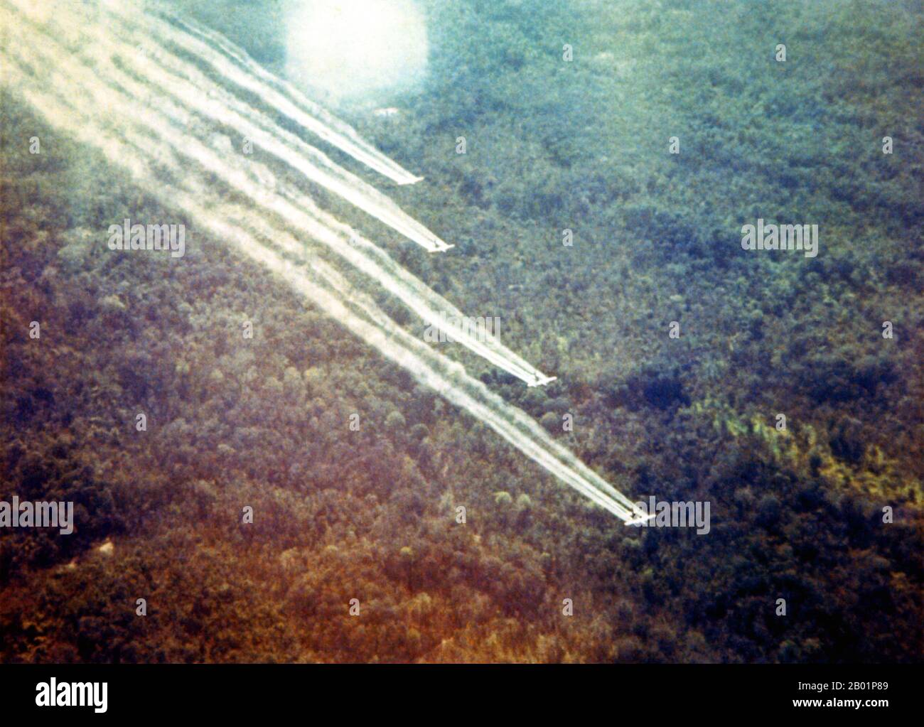 Vietnam: A formation of four USAF planes spraying agent orange during Operation Ranch Hand, c. 1965.  Operation Ranch Hand was a U.S. military operation during the Vietnam War; lasting from 1962 until 1971. It was part of the overall herbicidal warfare program during the war called 'Operation Trail Dust'. Ranch Hand involved spraying an estimated 20 million US gallons of defoliants and herbicides over rural areas of South Vietnam in an attempt to deprive the NLF (Viet Cong) of vegetation cover and food. Areas of Laos and Cambodia were also sprayed to a lesser extent. Stock Photo