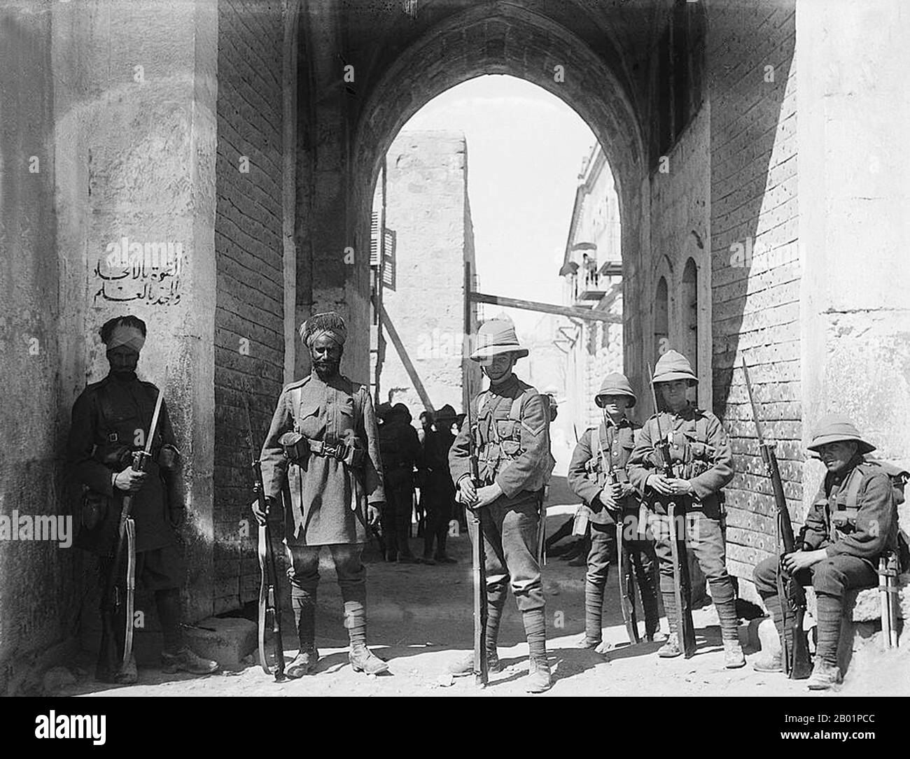 Palestine: British and Indian guards at St. Stephen's Gate, Jerusalem, 1920.  The Middle Eastern theatre of World War I was the scene of action between 29 October 1914, and 30 October 1918. The combatants were the Ottoman Empire, with some assistance from the other Central Powers, and primarily the British and the Russians among the Allies of World War I. There were five main campaigns: the Sinai and Palestine Campaign, the Mesopotamian Campaign, the Caucasus Campaign, the Persian Campaign and the Gallipoli Campaign. Stock Photo