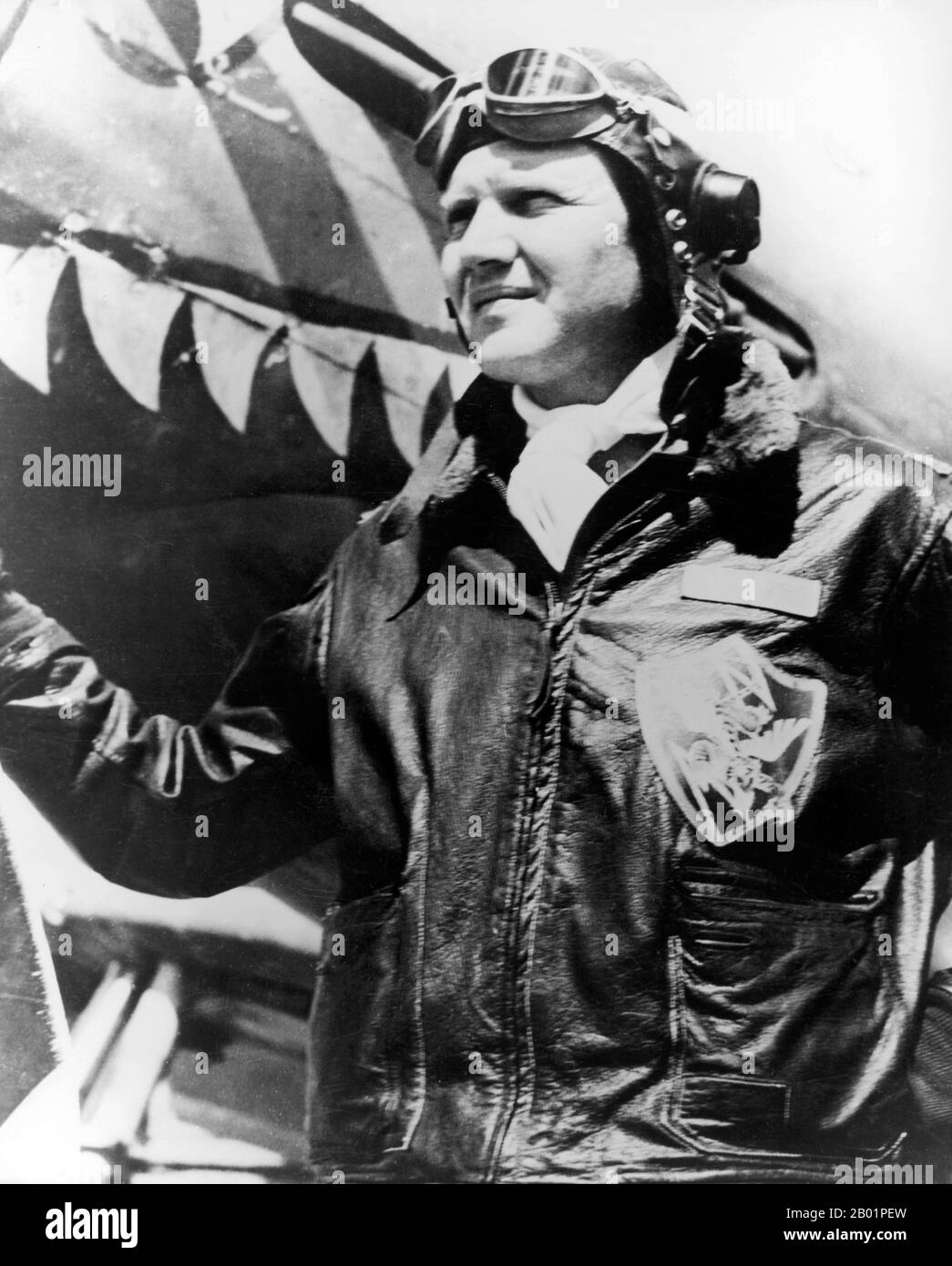 China/USA: David Lee 'Tex' Hill (13 July 1915 - 11 October 2007), fighter pilot and Flying Tigers ace in World War II, poses in front of a Curtiss P-40 Tomahawk Fighter, c. 1940s.  Triple ace Brigadier General David Lee “Tex” Hill served as leader of the American Volunteer Group’s (Flying Tigers) 2nd Squadron and commanded the Army Air Corps’ 75th Fighter Squadron and the 23rd Fighter Group. He was also the Texas Air National Guard’s first commander. Stock Photo
