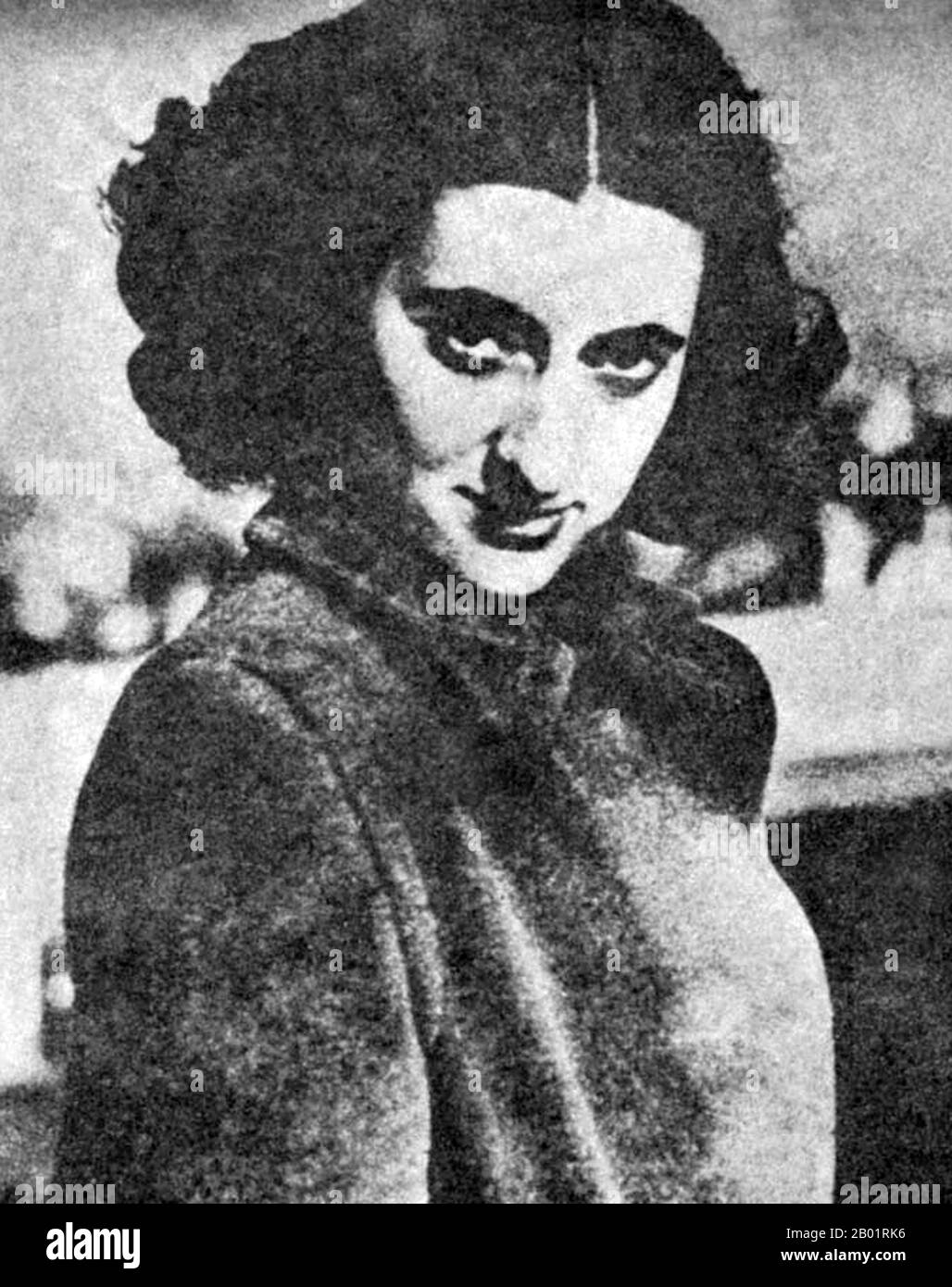 India: A young Indira Gandhi (19 November 1917 - 31 October 1984), subsequently Prime Minister of India for four consecutive terms (r. 1966-1984), late 1930s.  Indira Priyadarshini Gandhi was the Prime Minister of the Republic of India for three consecutive terms from 1966 to 1977 and for a fourth term from 1980 until her assassination in 1984, a total of fifteen years. She is India's only female prime minister to date and a central figure in India's post-colonial politics. She is the world's all time longest serving female Prime Minister. Stock Photo