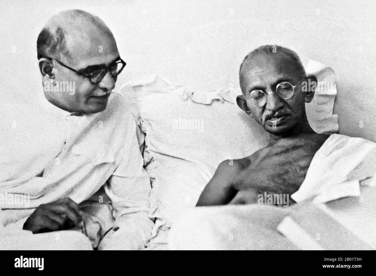 India: Mahatma Gandhi (2 October 1869 - 30 January 1948), preeminent political and ideological leader of India's independence movement, with his personal secretary Mahadev Desai (1892-1942), c. 1940.  Mohandas Karamchand Gandhi was the preeminent political and ideological leader of India during the Indian independence movement. He pioneered satyagraha. This is defined as resistance to tyranny through mass civil disobedience, a philosophy firmly founded upon ahimsa, or total non-violence. This concept helped India gain independence and inspired movements for civil rights and freedom globally. Stock Photo