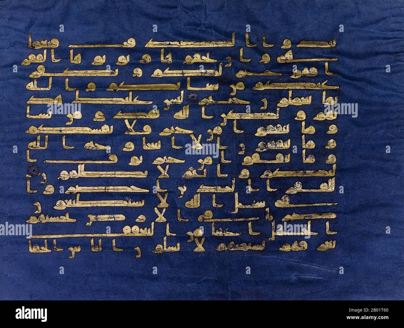 Tunisia: Surah al-Baqarah, verses 197-201, in Kufic script. From the 'Blue Qur'an', Qairawan, Tunisia, c. 1000 CE.  The Blue Qur'an is a late 9th - early 10th century Tunisian Qur'an manuscript in Kufic calligraphy. It is written in gold (chrysography) on parchment died with indigo, a unique aspect. It is among the most famous works of Islamic art, and has been called 'one of the most extraordinary luxury manuscripts ever created'.  The manuscript was dispersed during the Ottoman period; today most of it is located in the National Institute of Art and Archaeology in Tunis. Stock Photo