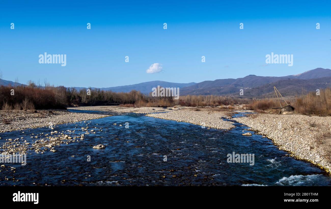 Lunigiana winter landscape view near Villafranca. Magra River and mountains behind. Stock Photo