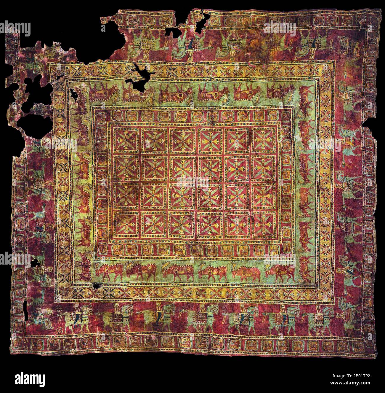 Russia: The Pazyryk carpet, the oldest known woven carpet in the world. Eastern Altai, Pazyryk Burial Mound 5, 5th-4th centuries BCE.  The Pazyryk burials are a number of Iron Age tombs found in the Pazyryk Valley of the Ukok plateau in the Altai Mountains, Siberia, south of the modern city of Novosibirsk, Russia; the site is close to the borders with China, Kazakhstan and Mongolia.  The tombs are Scythian-type kurgans, barrow-like tomb mounds containing wooden chambers covered over by large cairns of boulders and stones, dated to between the 6th and 3rd centuries BCE. Stock Photo