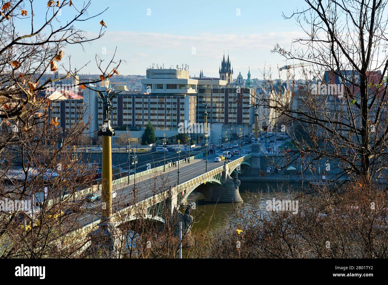 Prague, Czech Republic - December 3rd 2015: Cesky bridge aka Cechuv Most over river Moldau, buildings and church spire of Tayn church aka church of o Stock Photo