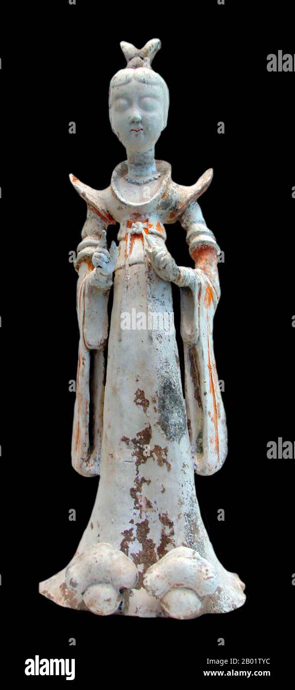 China: A terracotta sculpture of a lady of the court in elaborate dress, 7th-8th century.  The Tang Dynasty (18 June 618 - 1 June 907) was an imperial dynasty of China preceded by the Sui Dynasty and followed by the Five Dynasties and Ten Kingdoms Period. It was founded by the Li (李) family, who seized power during the decline and collapse of the Sui Empire. The dynasty was interrupted briefly by the Second Zhou Dynasty (8 October 690 - 3 March 705) when Empress Wu Zetian seized the throne, becoming the first and only Chinese empress regnant, ruling in her own right. Stock Photo