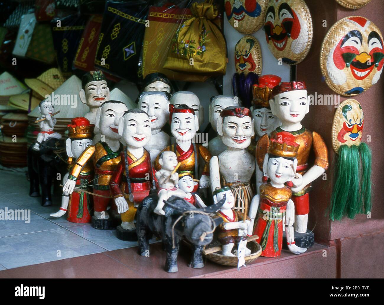 Vietnam: Water puppets for sale near Ho Hoan Kiem Lake, Hanoi.  Water Puppetry or Múa rối nước, literally 'puppets that dance on water' originated in the Red River Delta. The puppets are carved from water-resistant wood to represent traditional rural lifestyles and mythical creatures. Standing behind the watery stage, waist-deep in water, the hidden puppeteers skillfully manoeuvre their wooden charges to the music of a traditional orchestra. Stock Photo