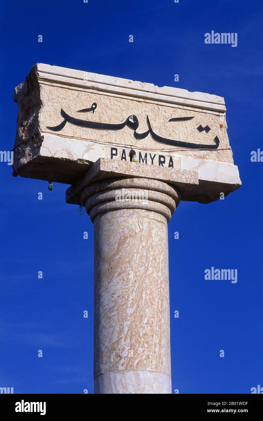 Syria: Columns at the entrance to the ruins, Palmyra.  Palmyra was an ancient city in Syria. It was an important city in central Syria, located in an oasis 215 km northeast of Damascus and 180 km southwest of the Euphrates at Deir ez-Zor. It had long been a vital caravan city for travellers crossing the Syrian desert and was known as the Bride of the Desert. The earliest documented reference to the city by its Semitic name Tadmor, Tadmur or Tudmur (which means 'the town that repels' in Amorite and 'the indomitable town' in Aramaic) is recorded in Babylonian tablets found in Mari. Stock Photo