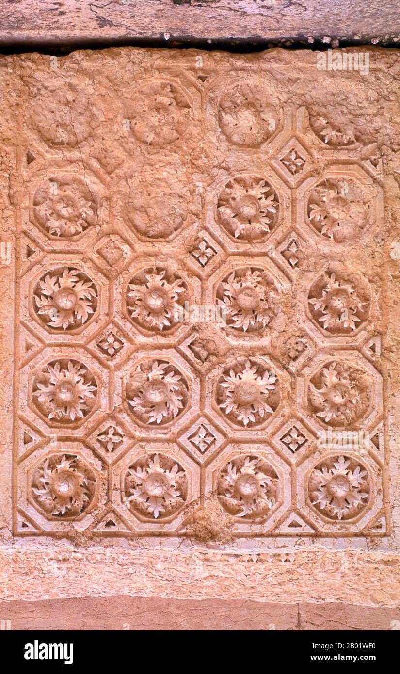 Syria: Wall decoration in the Temple of Bel, Palmyra.  The Temple of Bel, consecrated to the Semitic god Bel, worshipped at Palmyra as Malakbel, formed the centre of religious life in Palmyra and was dedicated in 32 CE.  Palmyra was an ancient city in Syria. It was an important city in central Syria, located in an oasis 215 km northeast of Damascus and 180 km southwest of the Euphrates at Deir ez-Zor. It had long been a vital caravan city for travellers crossing the Syrian desert and was known as the Bride of the Desert. Stock Photo